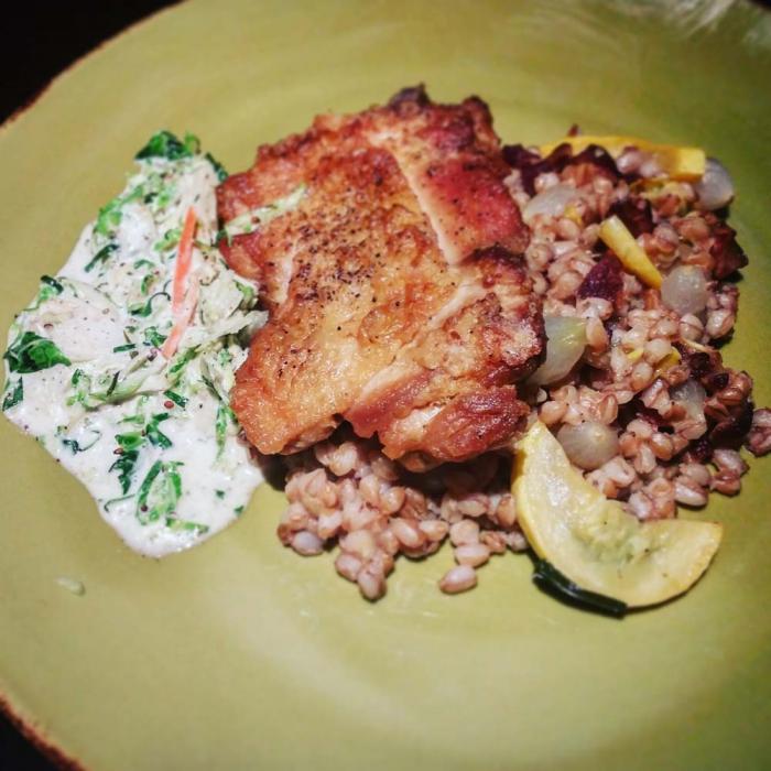 The Ashburn: seared chicken thigh with Farro pilaf of squash, bacon, pearl onions, and lemon-tarragon coleslaw.